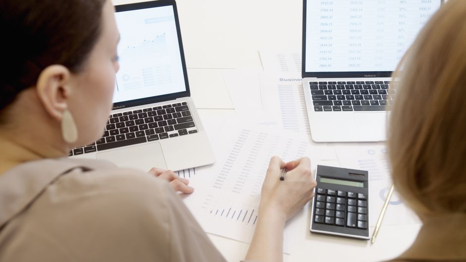 charter school administrator analyzing financial spreadsheets and budget projections