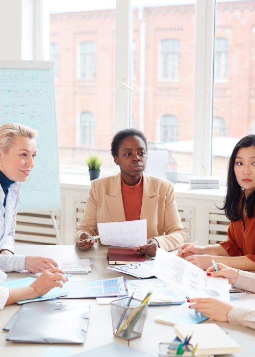 Group of Businesswomen at Meeting in Office